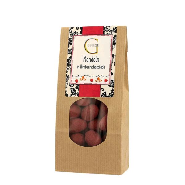 Genial Genießen Mandeln in Himbeerschokolade nachhaltig verpackt in Kraftpapiertüte
